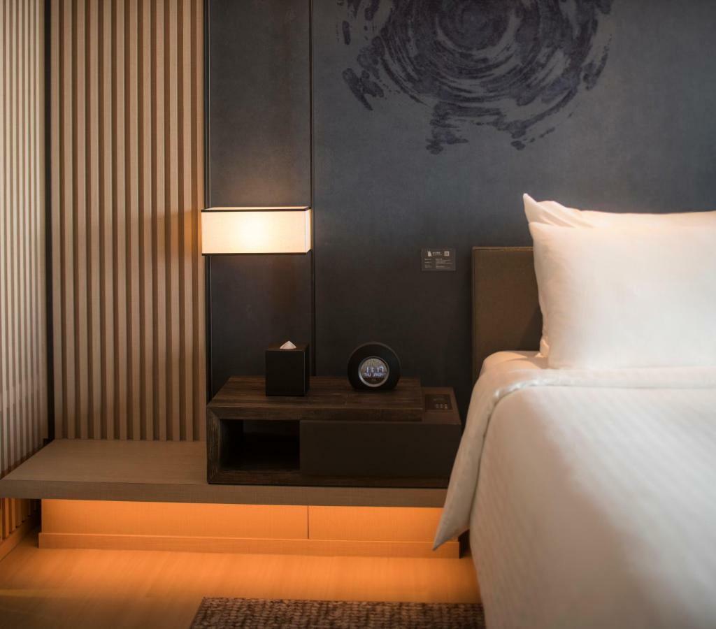 Mu Jiaoxi Hotel Exterior foto A room at the hotel